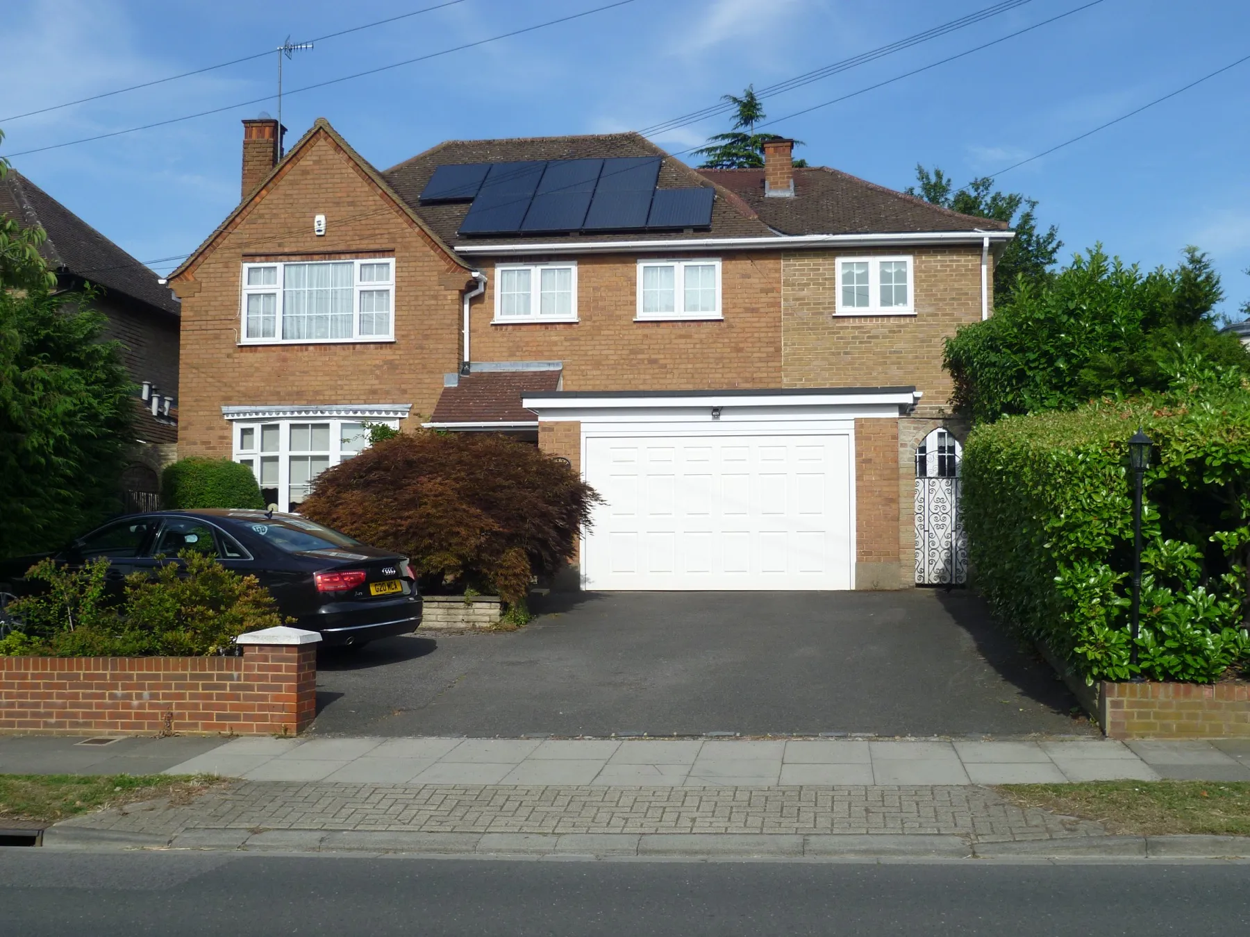 Solar panels on the roof of a brick house